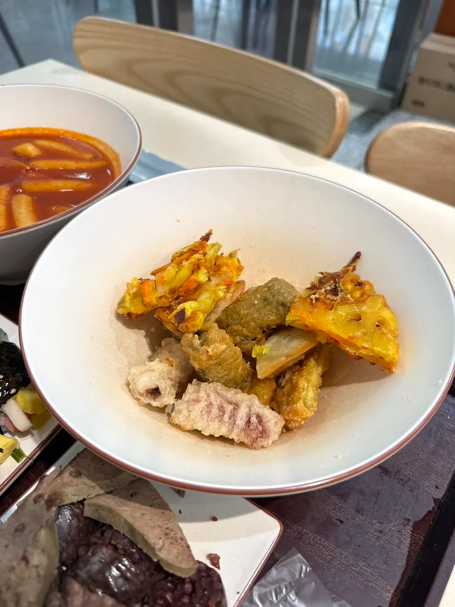 A gimbap and tteokbokki spread sized for two or three people