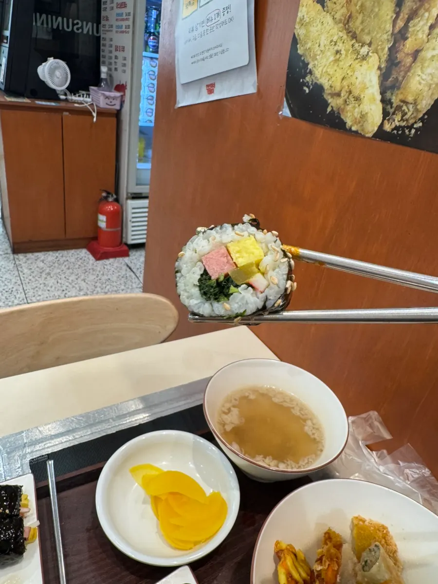 A piece of sesame-oil-coated gimbap