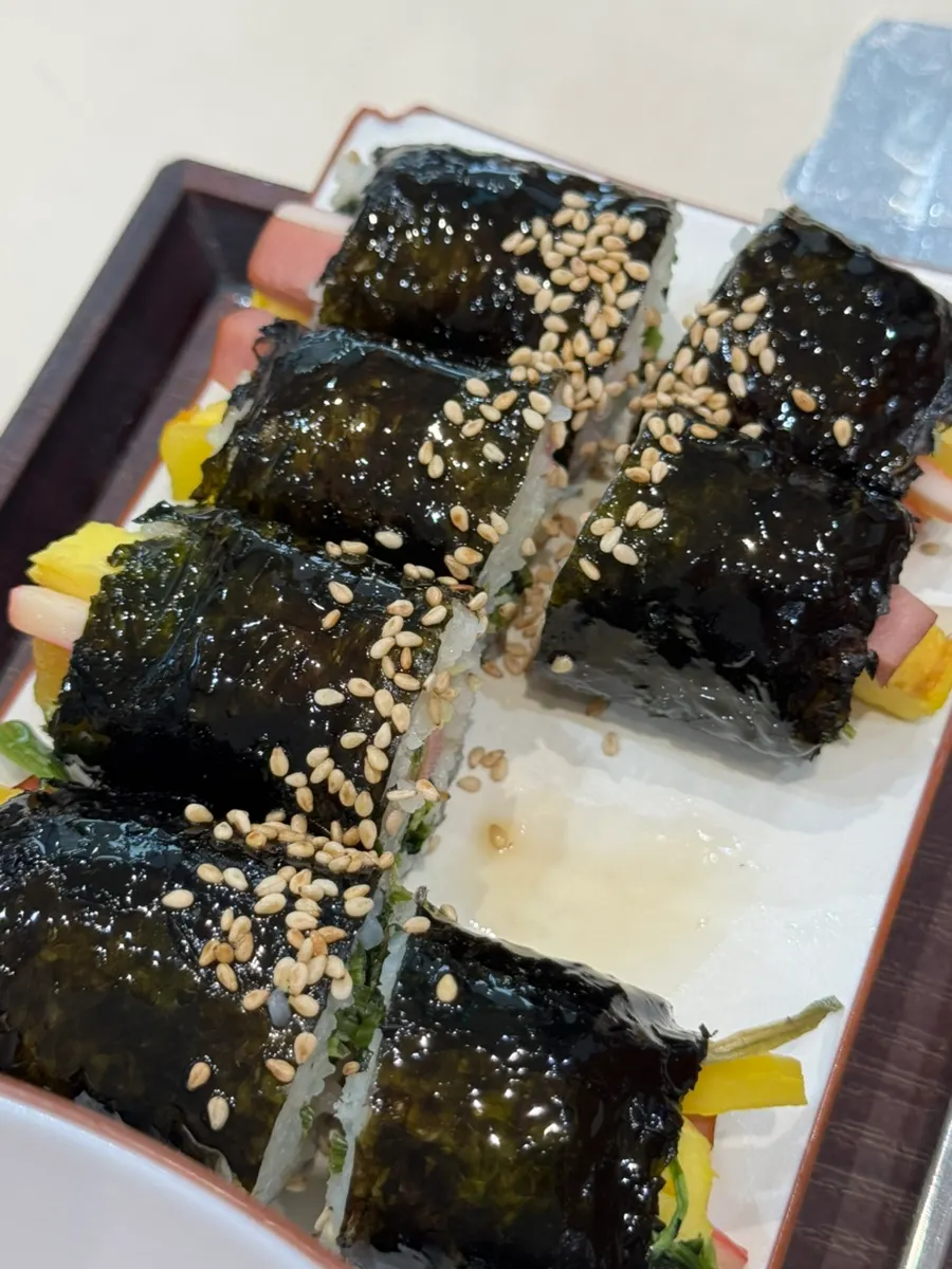 Cross-section of gimbap glistening with sesame oil
