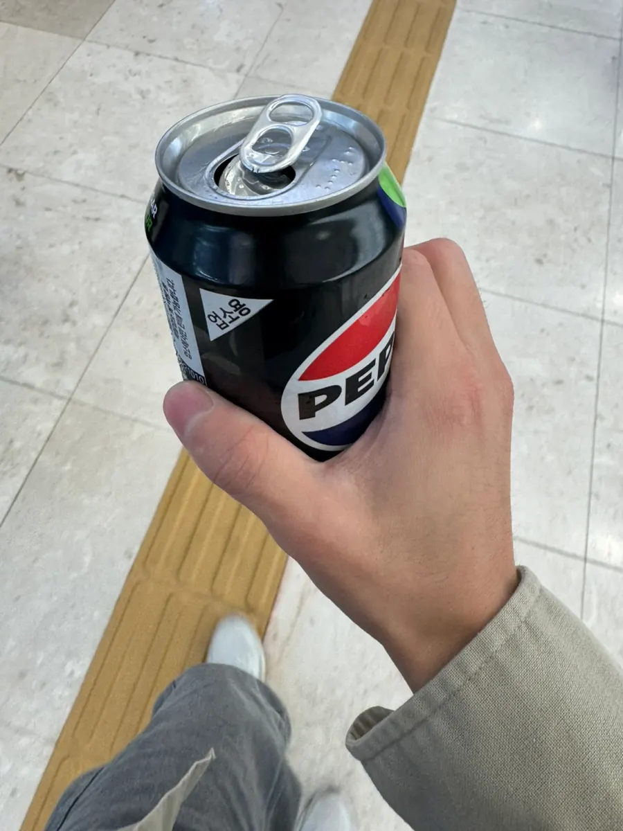 An empty Coke glass finished to the last drop