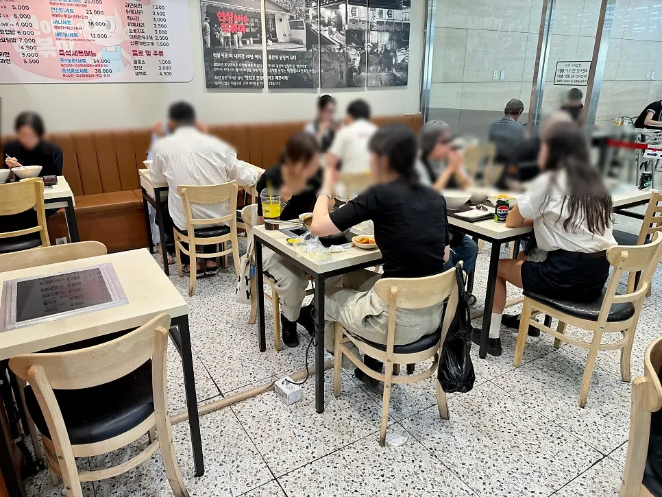 Indoor seating and induction tables at Hyeonseonine