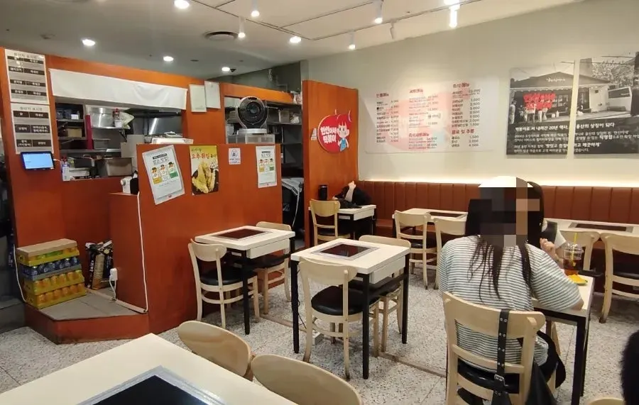 Entrance and outdoor seating at Hyeonseonine Premium IFC Mall Branch