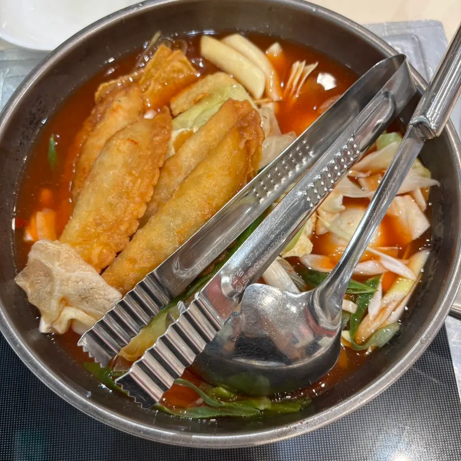 Table setting of ordered instant tteokbokki and side dishes