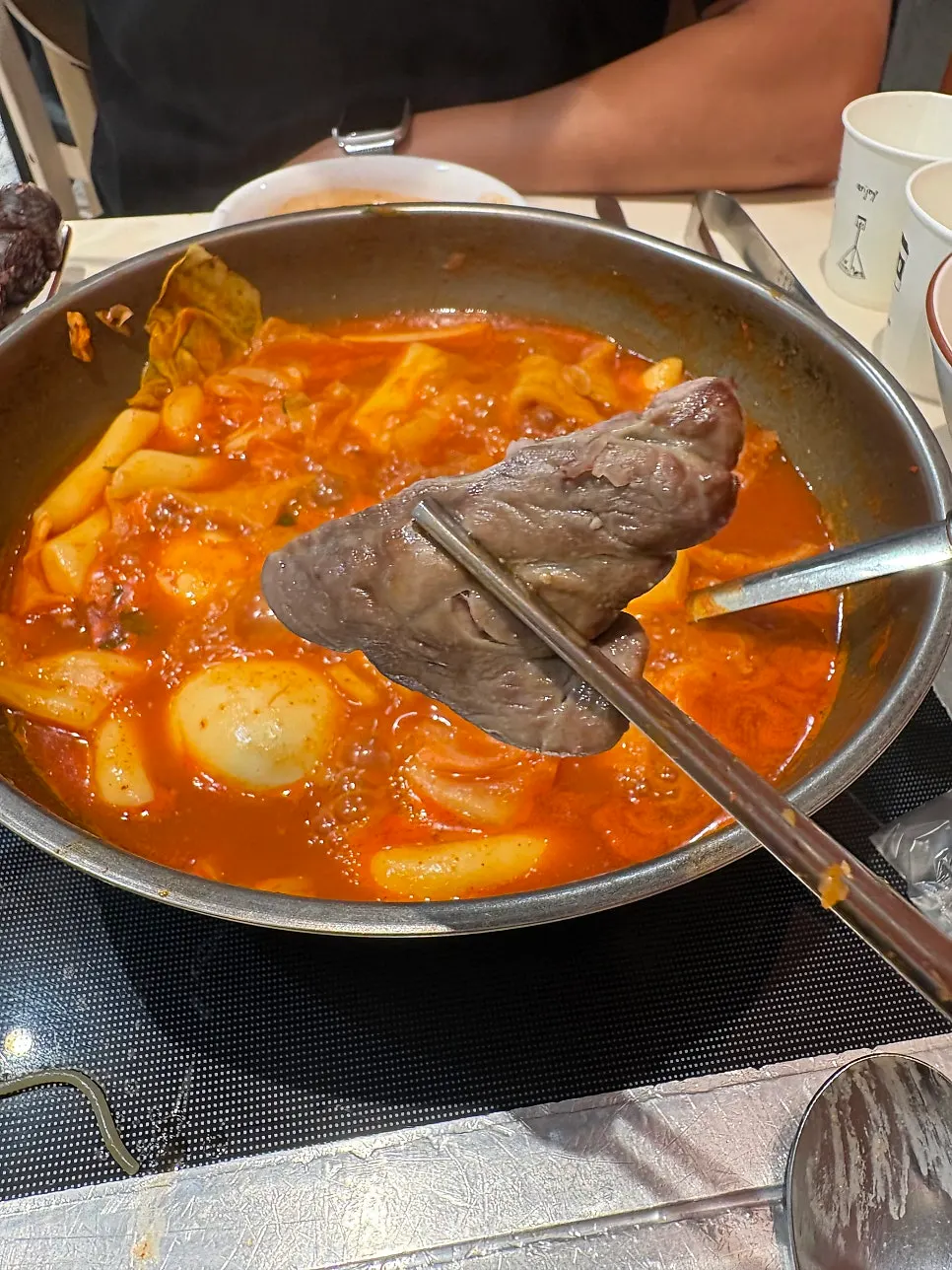 A plate of sundae, half organ meat and half blood sausage