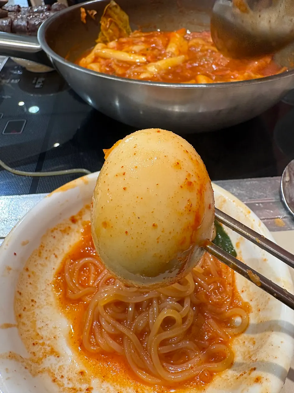 Organ meat dipped into tteokbokki broth
