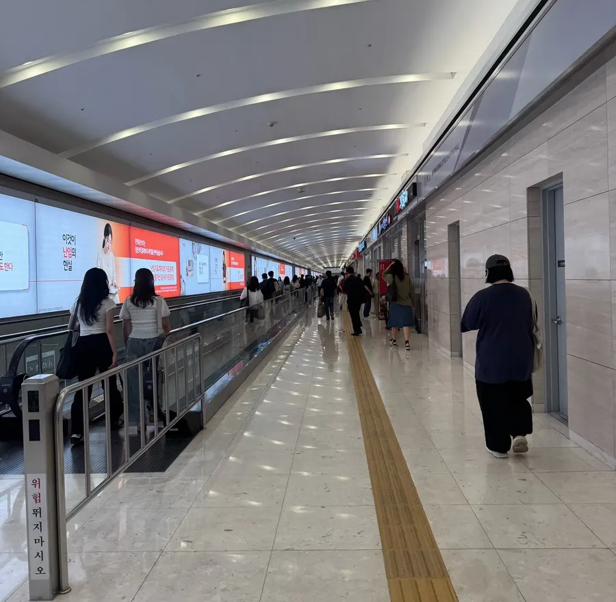 Corridor leading down to basement level 2 of IFC Mall