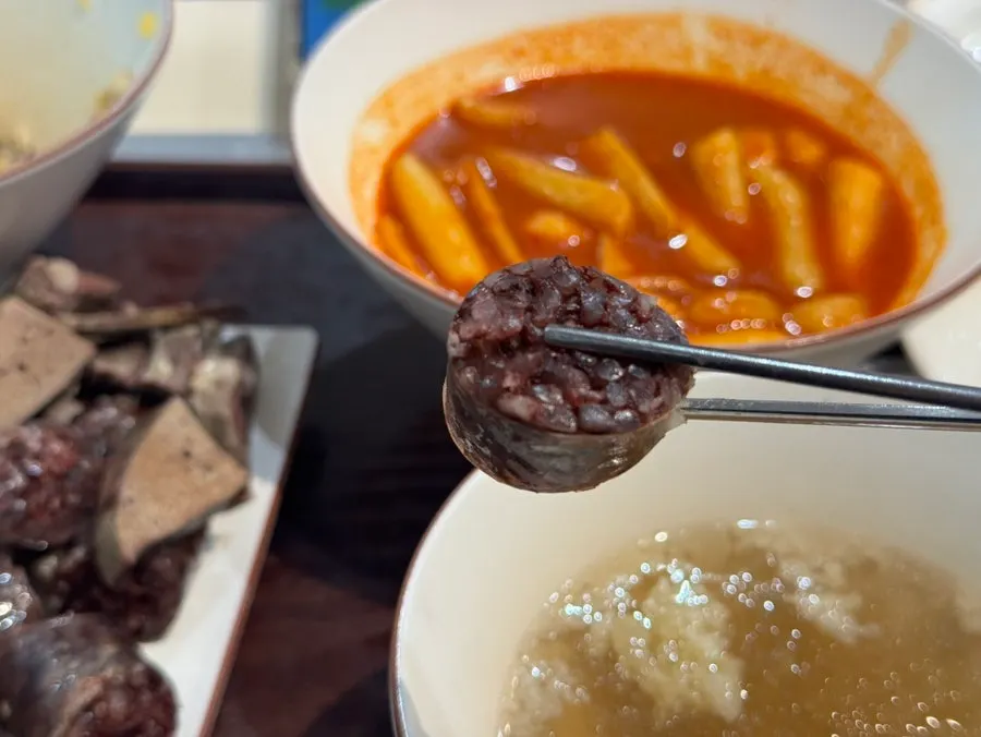 Broth tteokbokki showing plump, chewy rice cakes