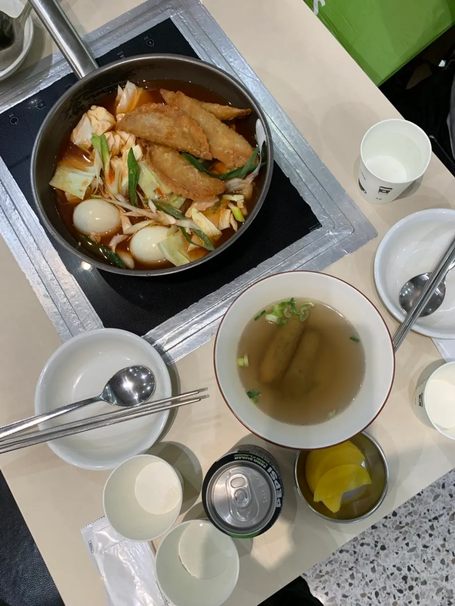 Self-serve bar with pickled radish and individually packaged salt and soy sauce