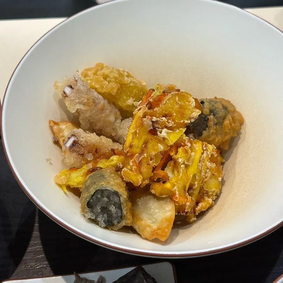 A piece of sundae paired with tteokbokki