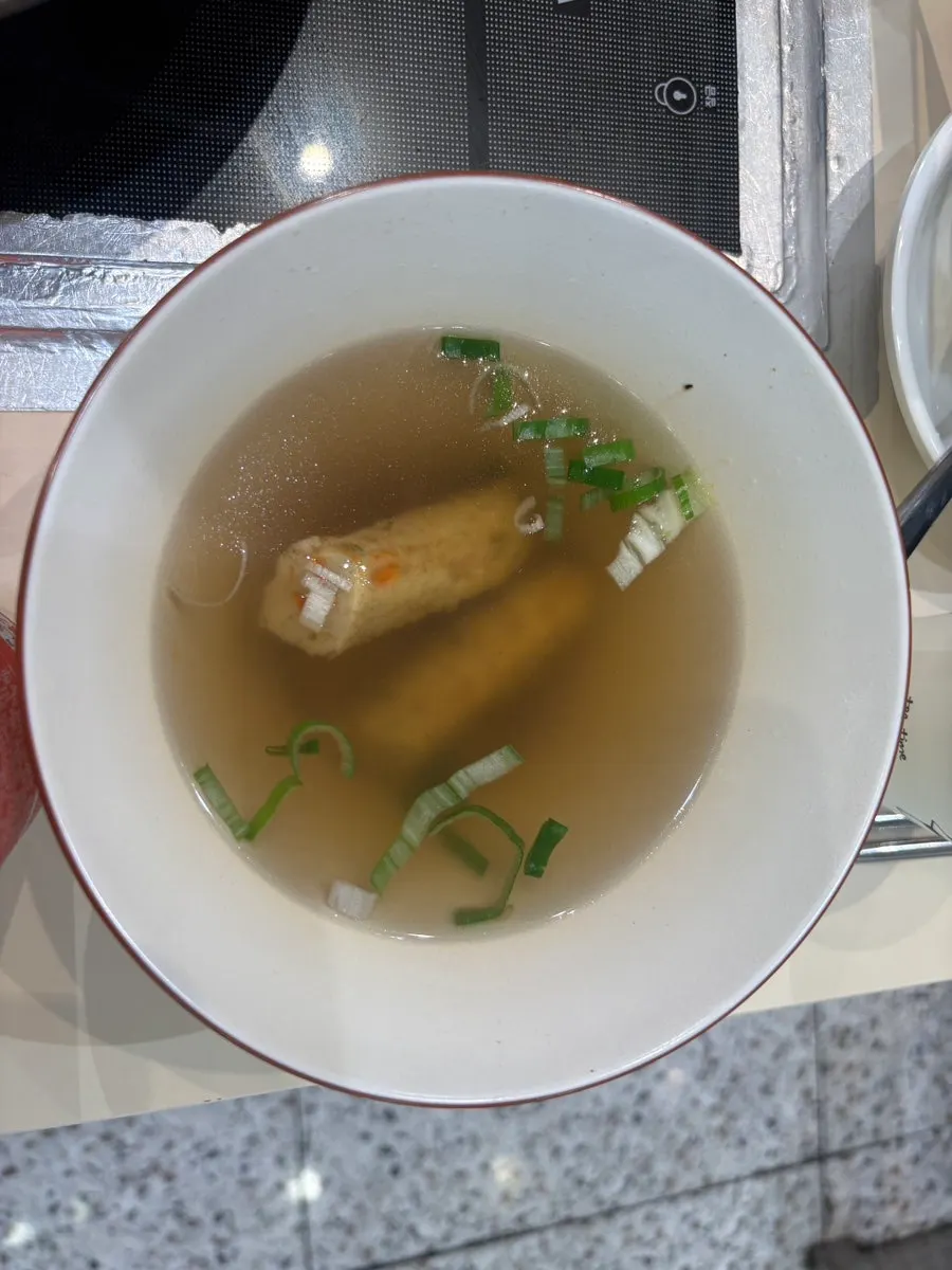 Close-up of chewy tteokbokki soaked in sauce