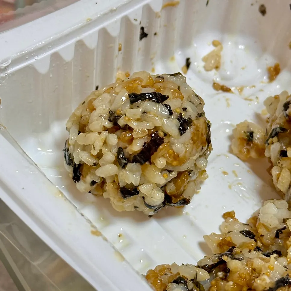 Sesame mayo rice balls topped with seaweed flakes and sauce