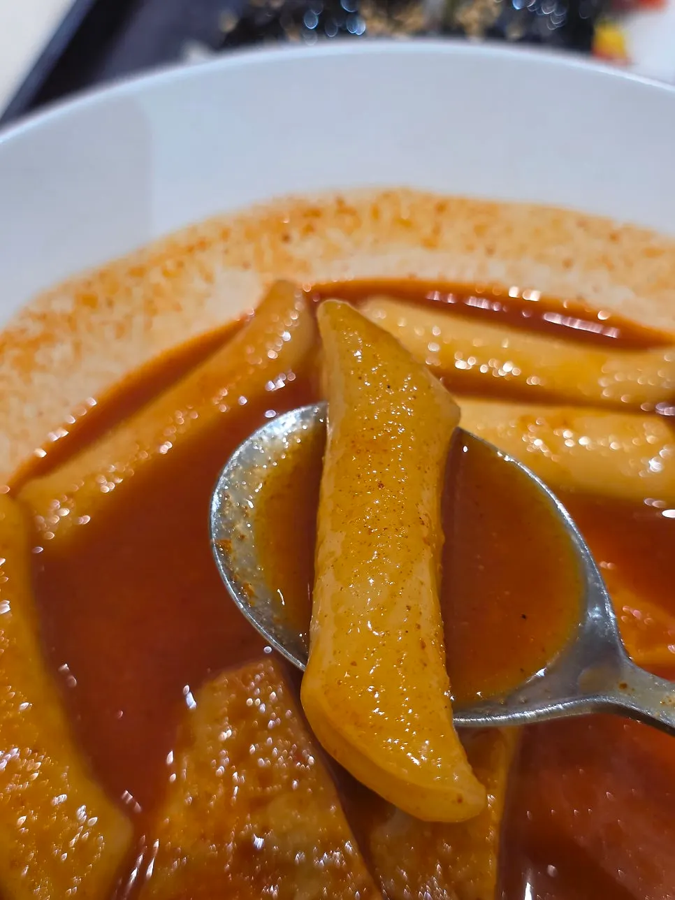 Wheat rice cake soaking up the tteokbokki sauce