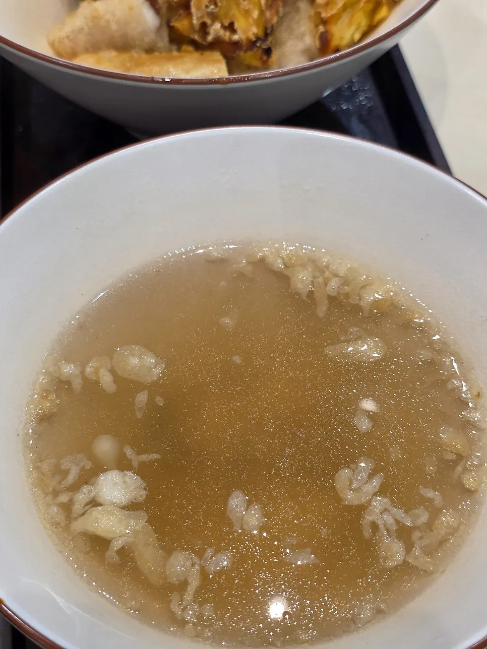 Fish cake broth served in a cup