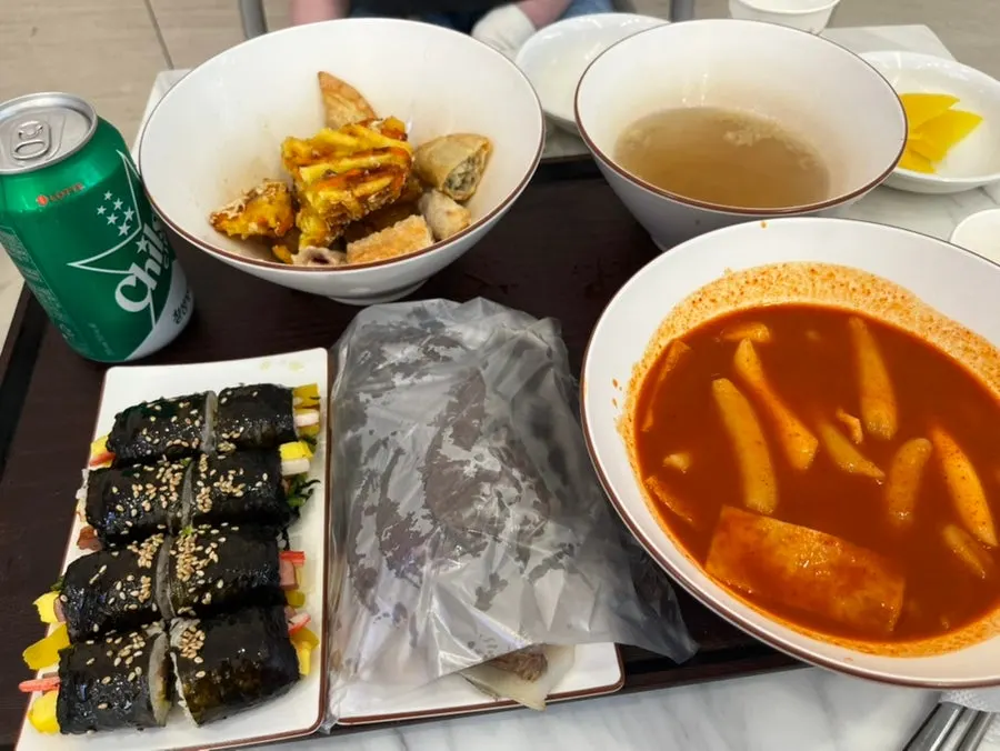 Hyeonseon Set table spread with tteokbokki, fried snacks, sundae, and gimbap