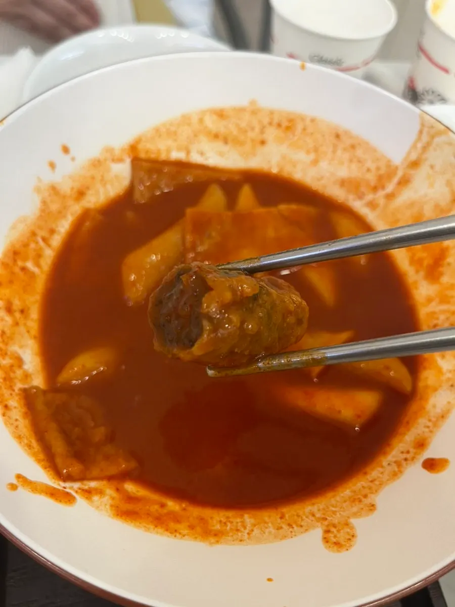 Gimmari and fried squid dipped in tteokbokki broth