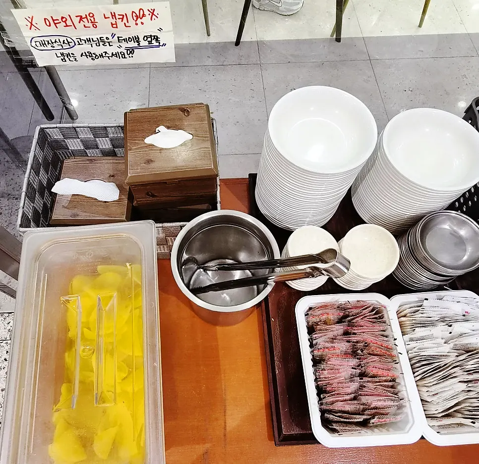 Self-serve bar with spoons, aprons, and wet wipes