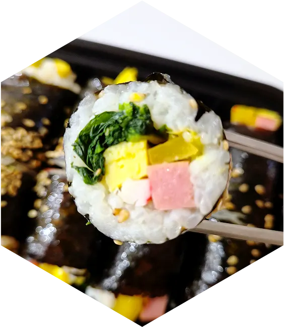 Cross-section of mini gimbap with visible sesame oil sheen