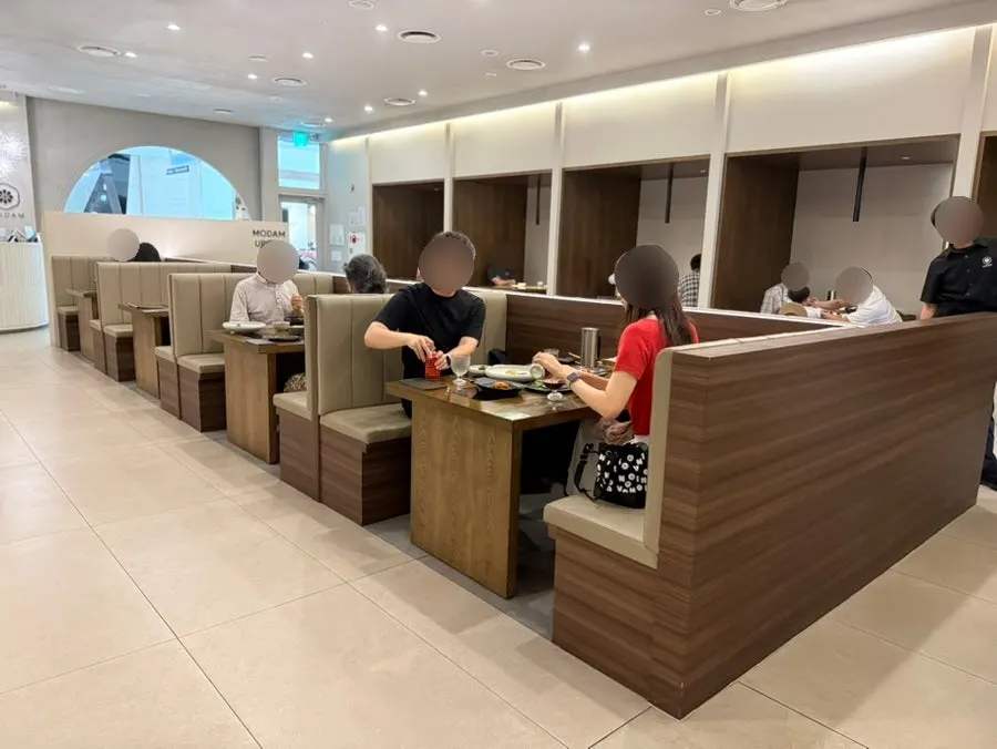 Modam Urban's modern white-toned dining hall seating