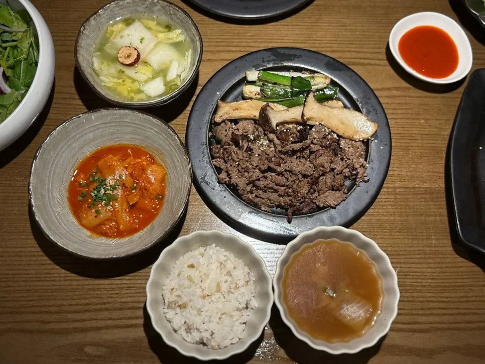 Smoky crispy bulgogi with grilled scallions and mushrooms