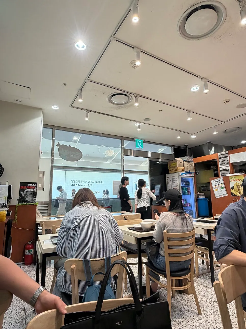 Inside the restaurant around 1:30 pm with customers seated