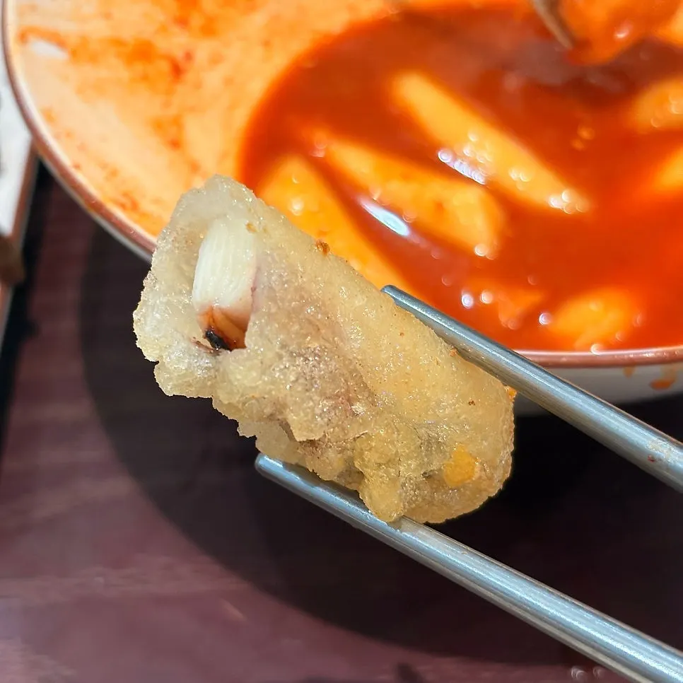 Fried snacks including gimmari, squid, sweet potato, and vegetables