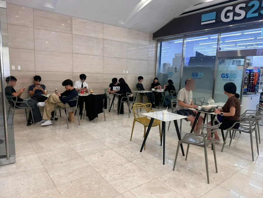 Basement level 2 corridor of IFC Mall with the Hyeonseonine storefront next to GS25