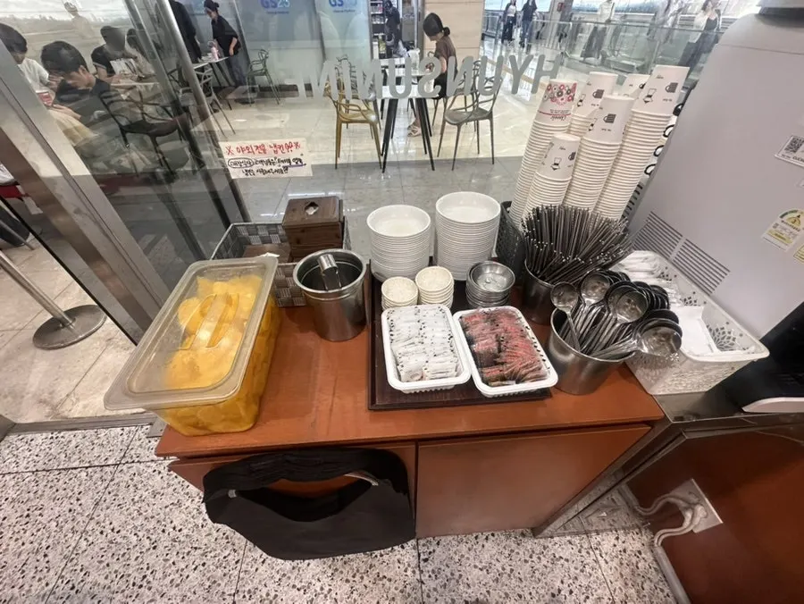 Hyeonseonine self-serve bar with pickled radish, soy sauce, and salt