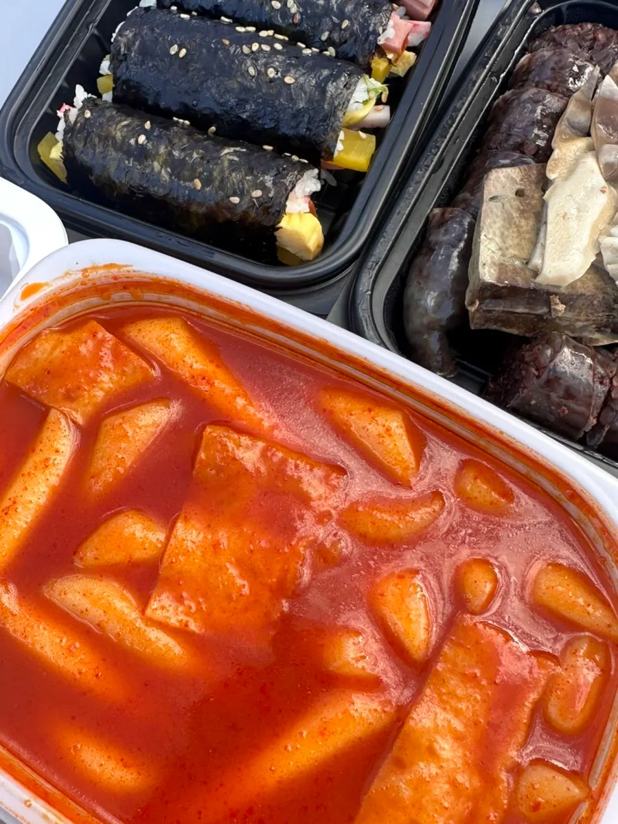 Hyeonseonine set with tteokbokki, fried snacks, sundae, and gimbap