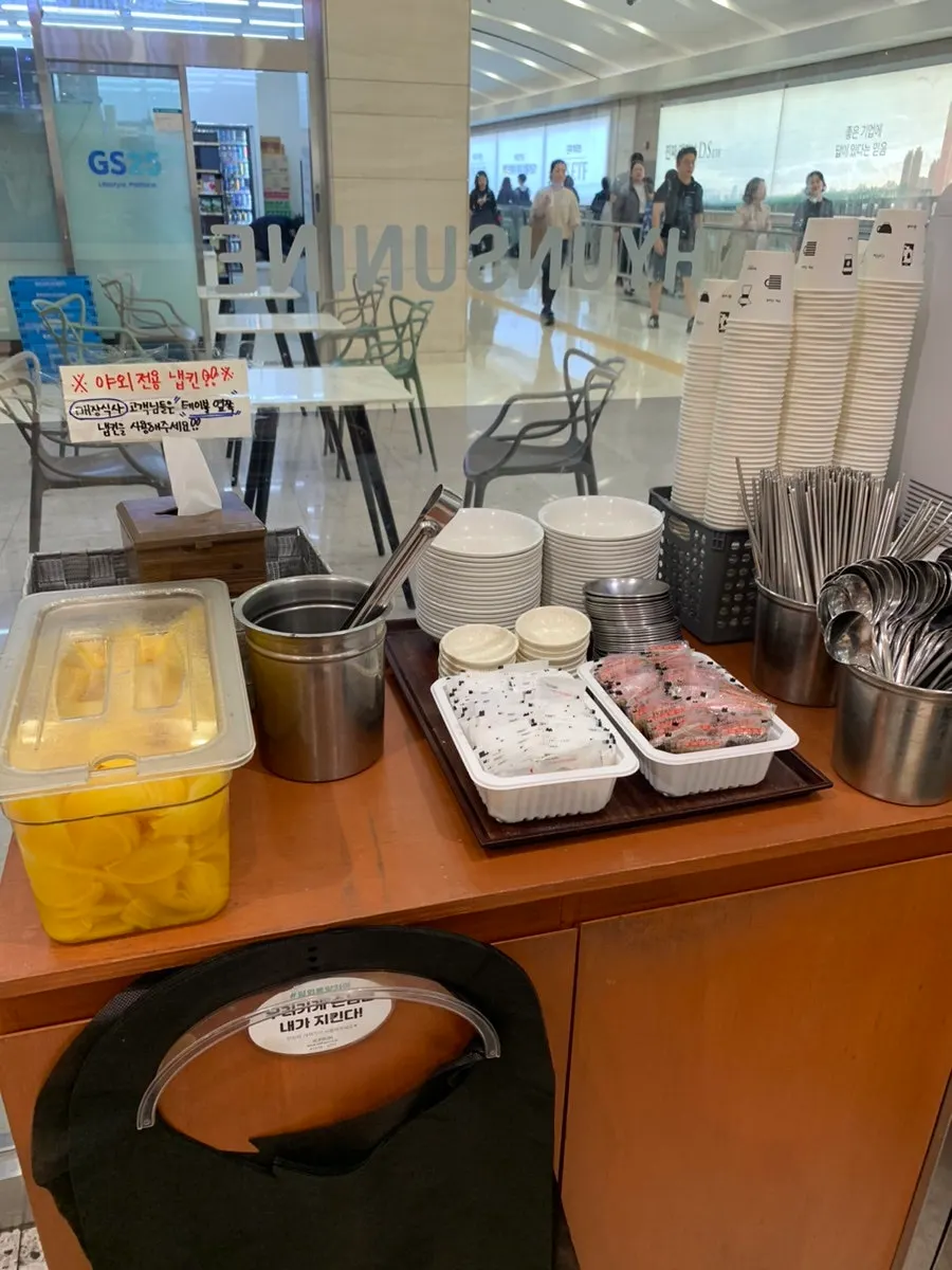 Self-serve bar with pickled radish, salt, and utensils