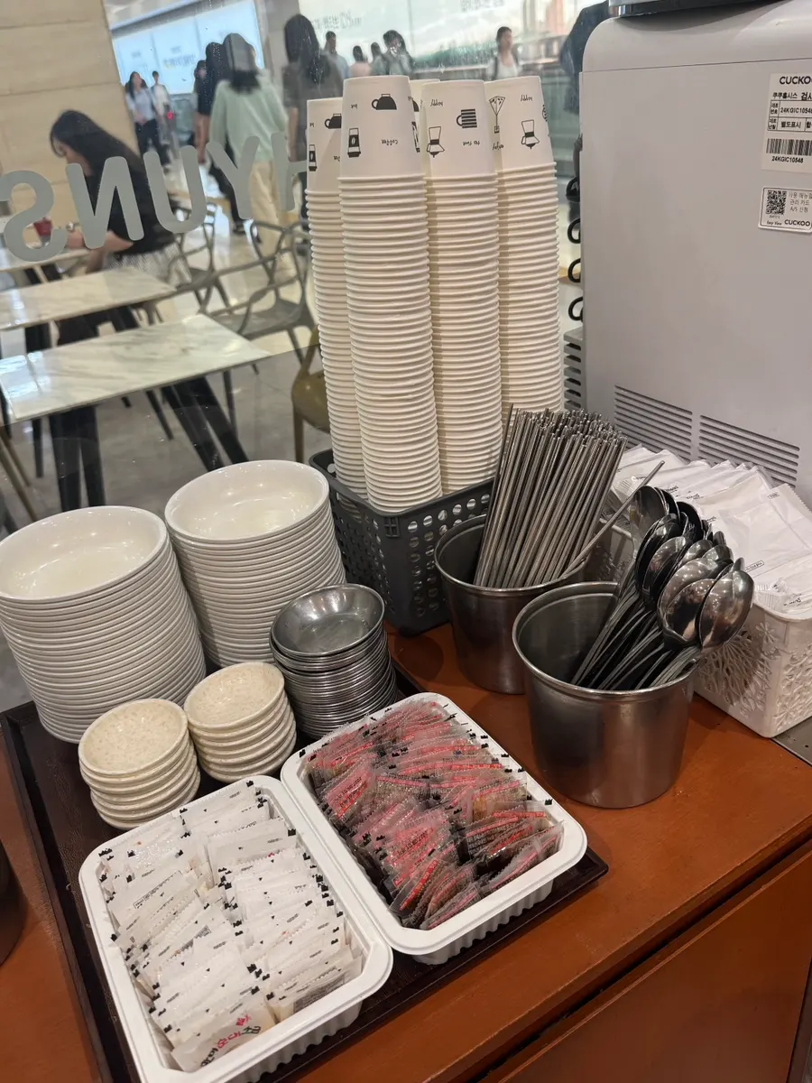 Pickled radish and basic condiments at the self-serve bar