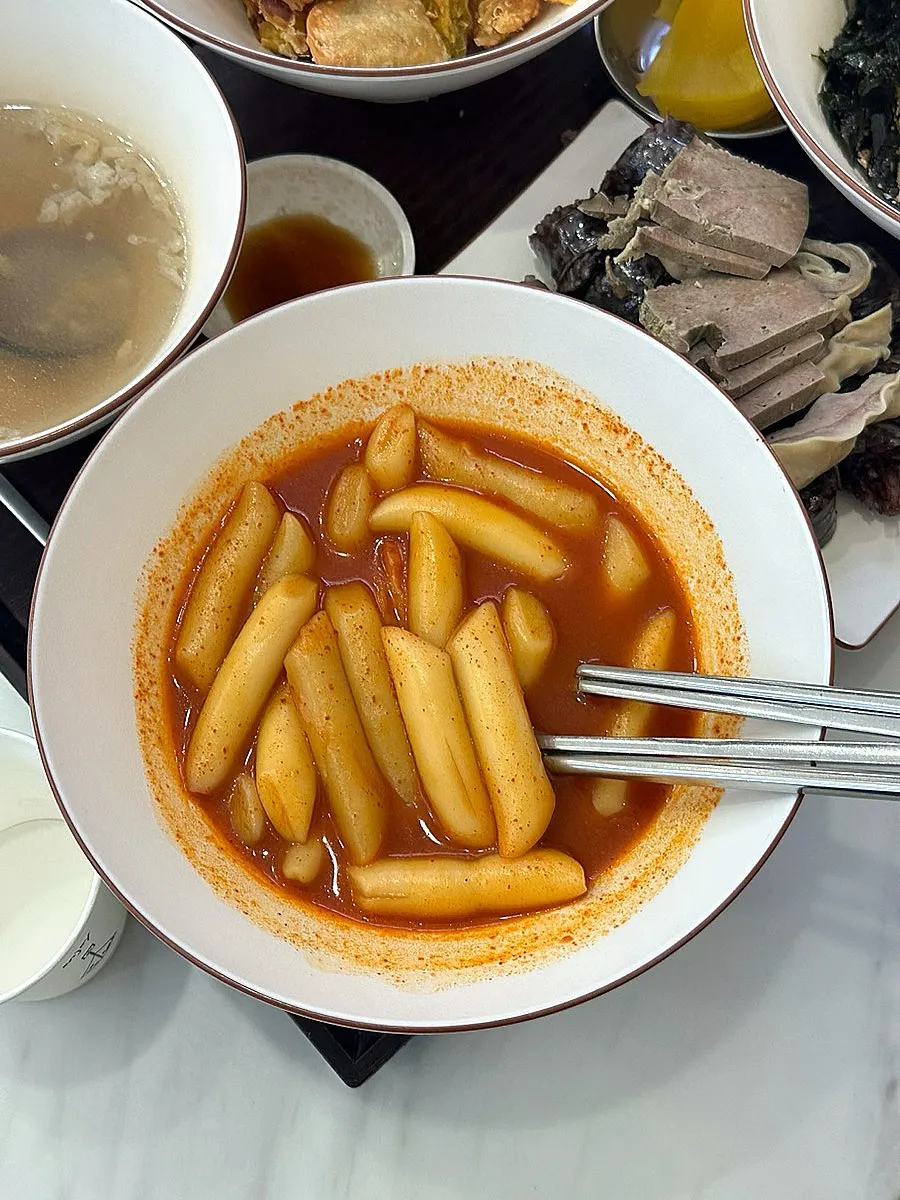A full spread of Korean snack food laid out on the table