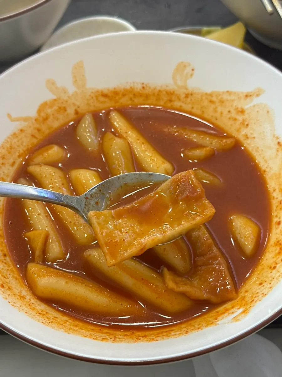 A plate of tteokbokki with spicy-sweet broth
