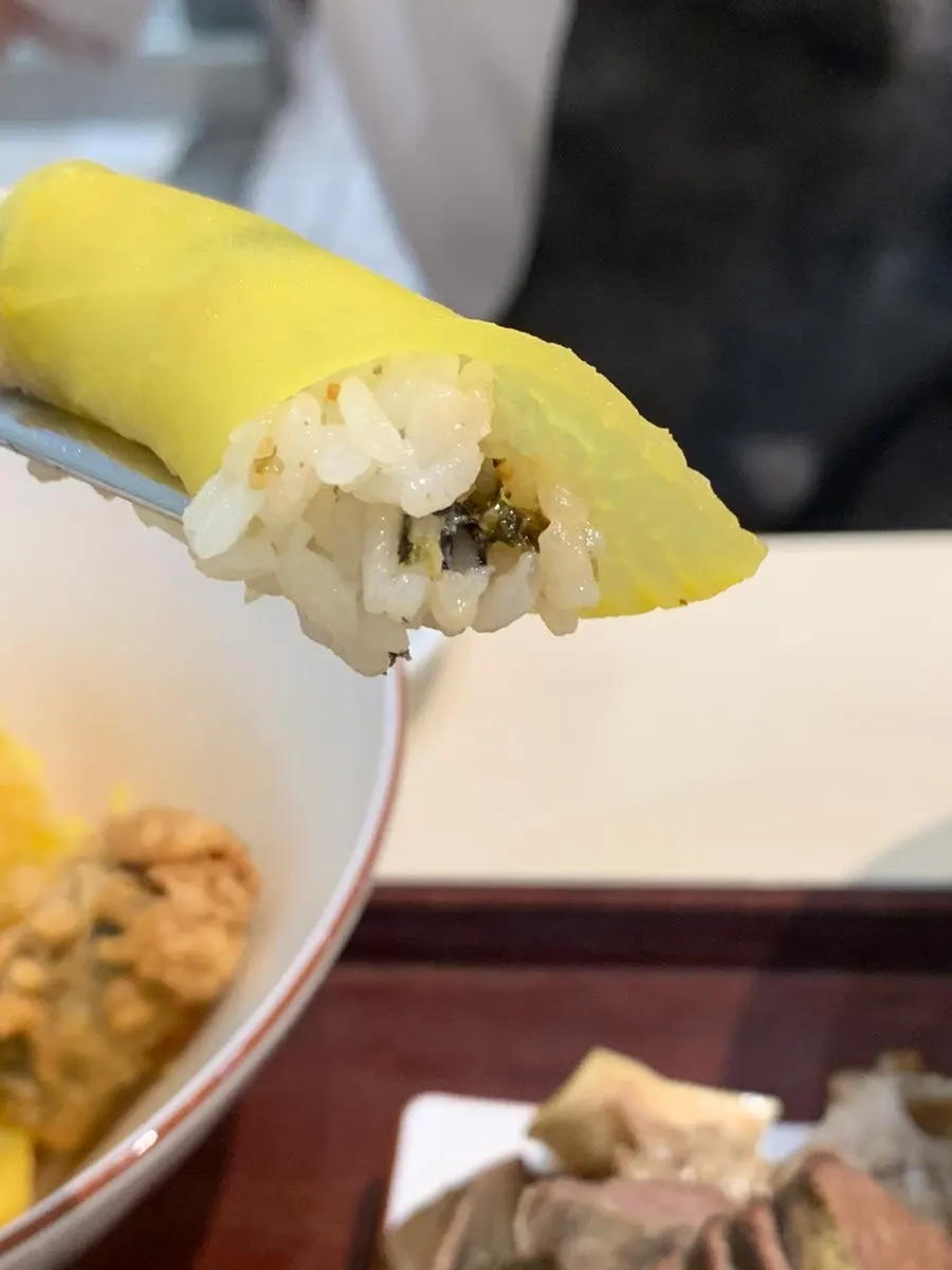 Cross-section of a squid fritter with a chunky piece of squid