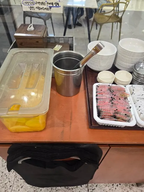 Hyeonseonine self-serve bar with pickled radish and utensils