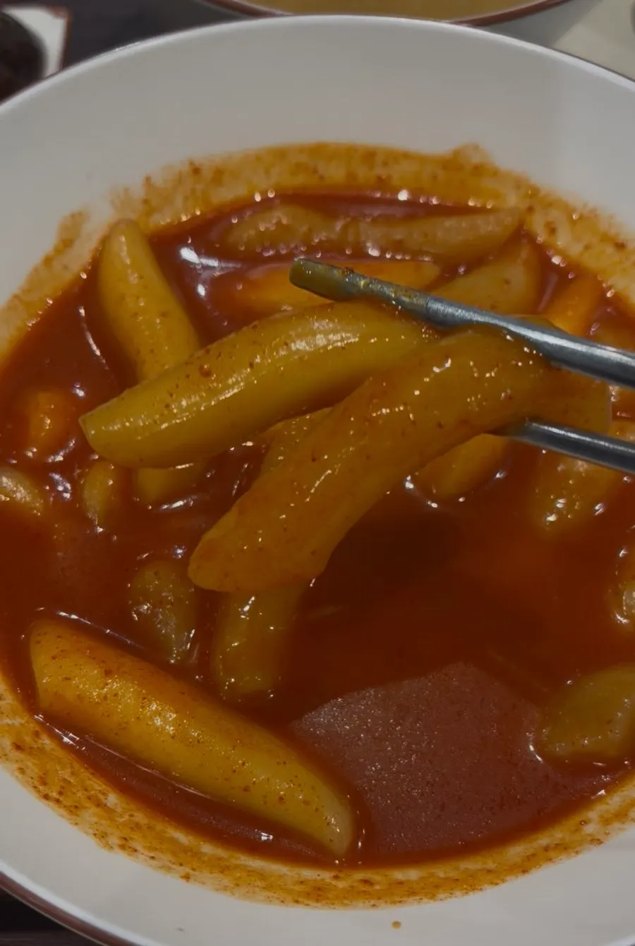 Close-up of mild-spice wheat tteokbokki with plenty of broth