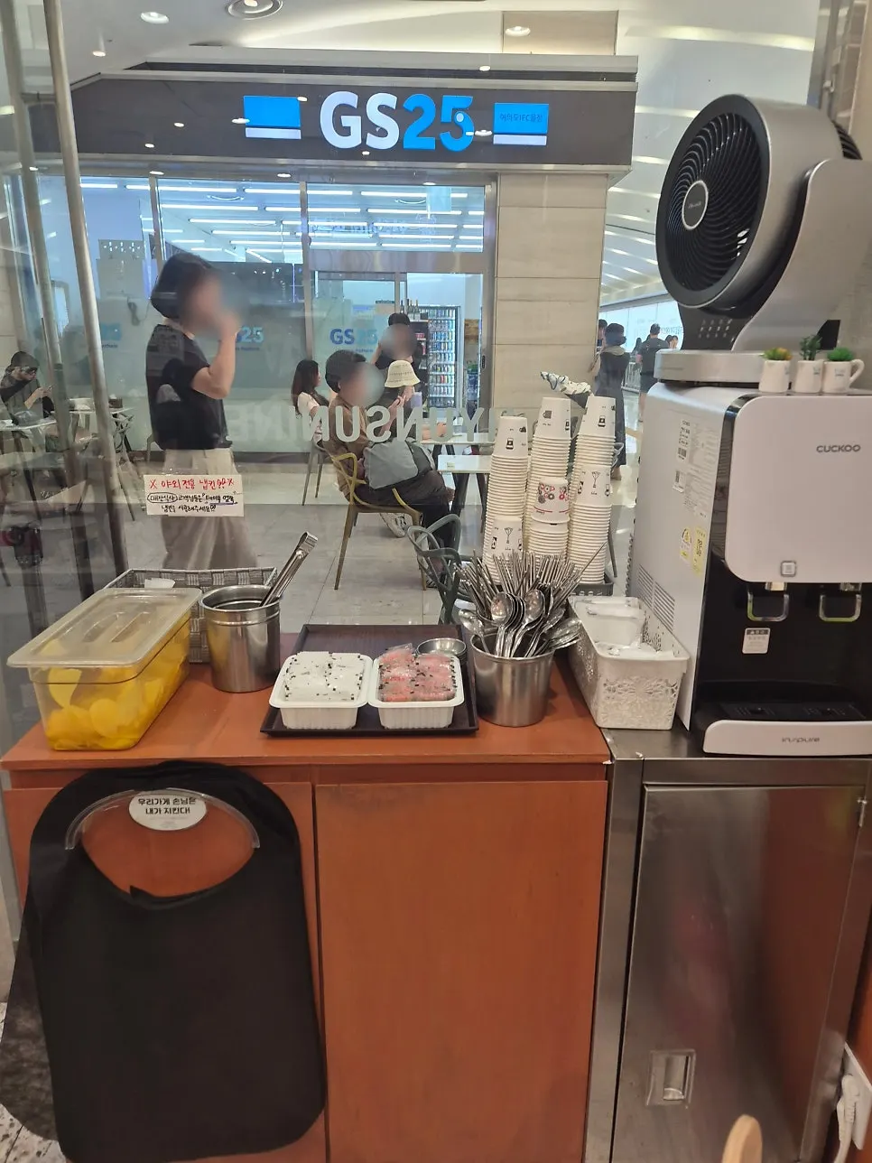 Self-serve bar with pickled radish, salt, water dispenser and utensils