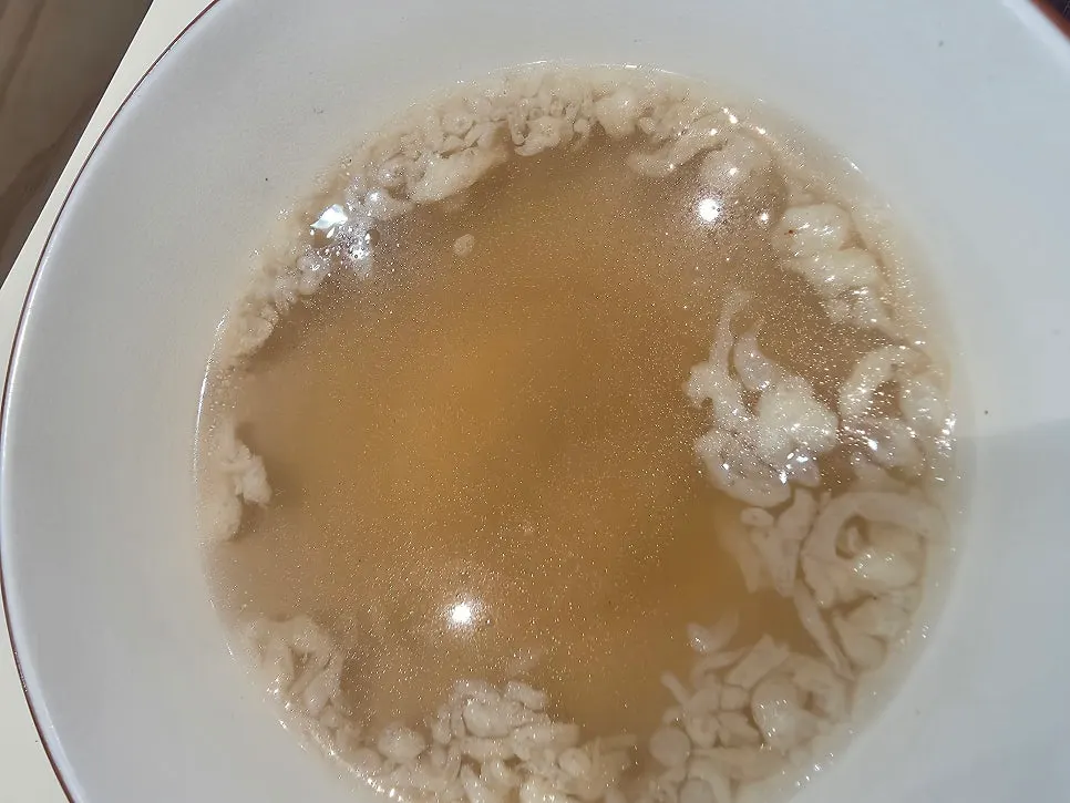 Warm broth served alongside the set