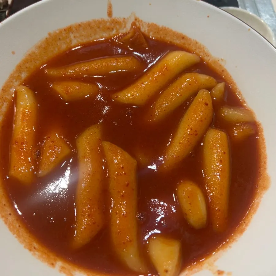 A full spread of the Hyeonseoni Set with tteokbokki, fried snacks, and sundae