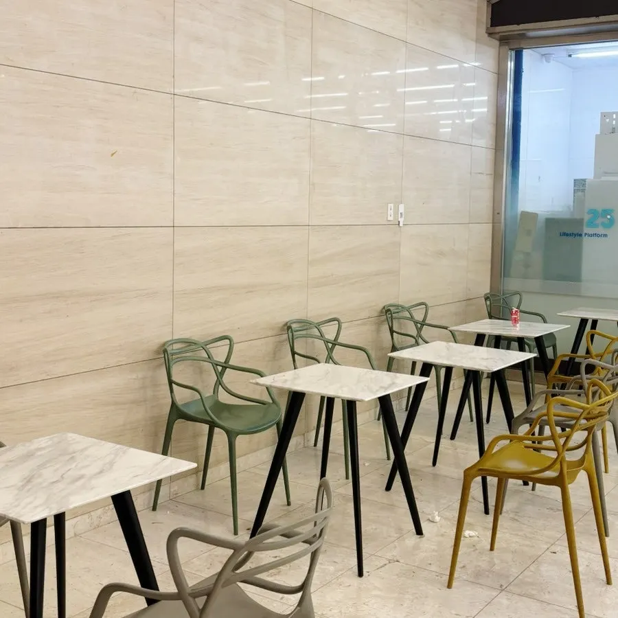 Outdoor table seating by the entrance