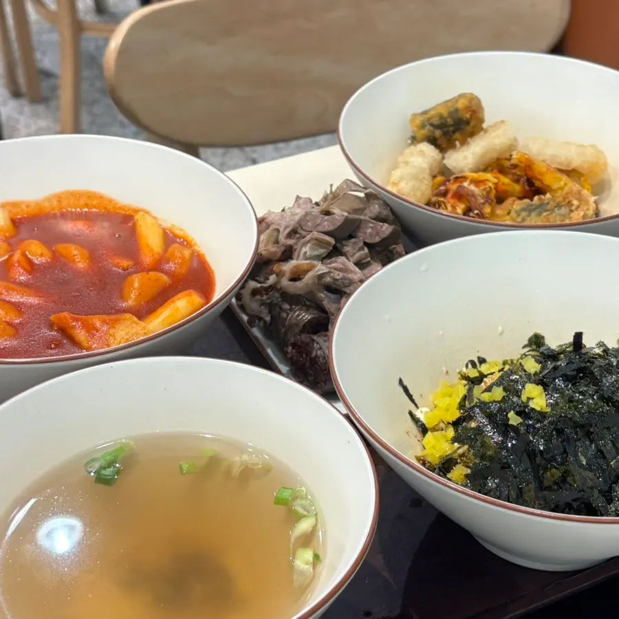 Set with tteokbokki, sundae, fried snacks, rice ball, and fish cake broth