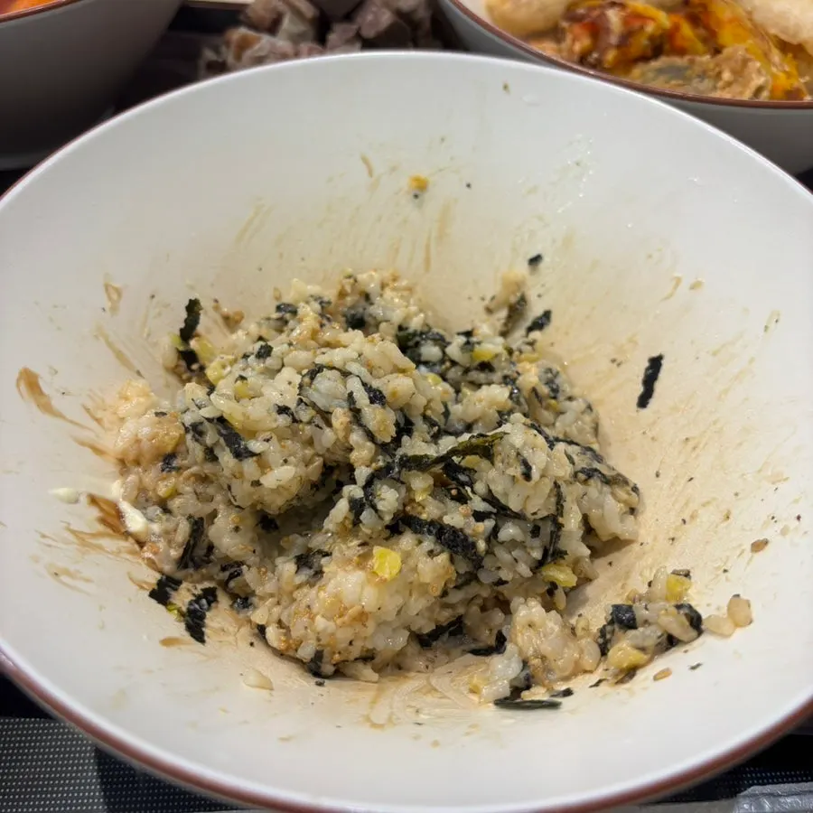 A bite of the mayo-topped rice ball