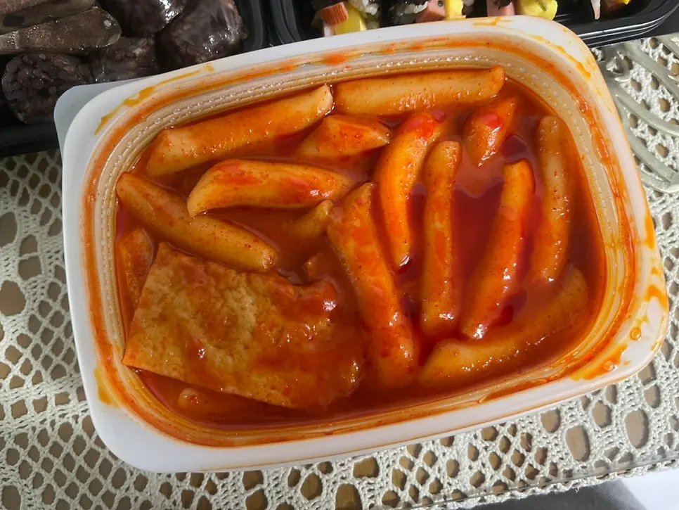 A full spread of tteokbokki, fried snacks, gimbap and sundae
