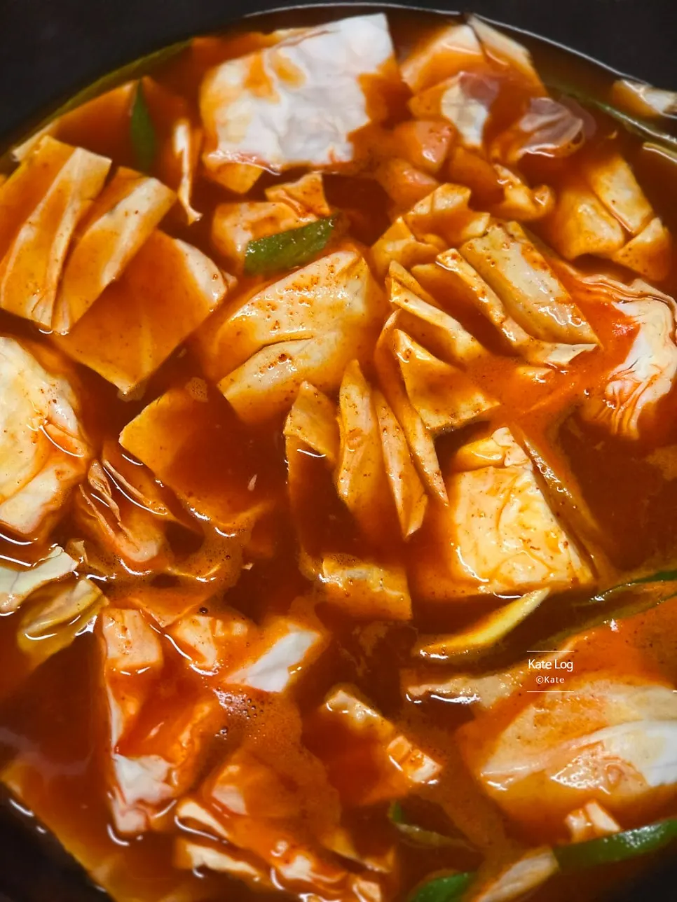 Water and seasoning sauce being boiled in a pot