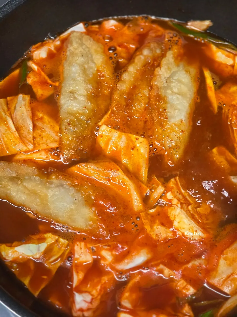Instant tteokbokki starting to boil with all ingredients added