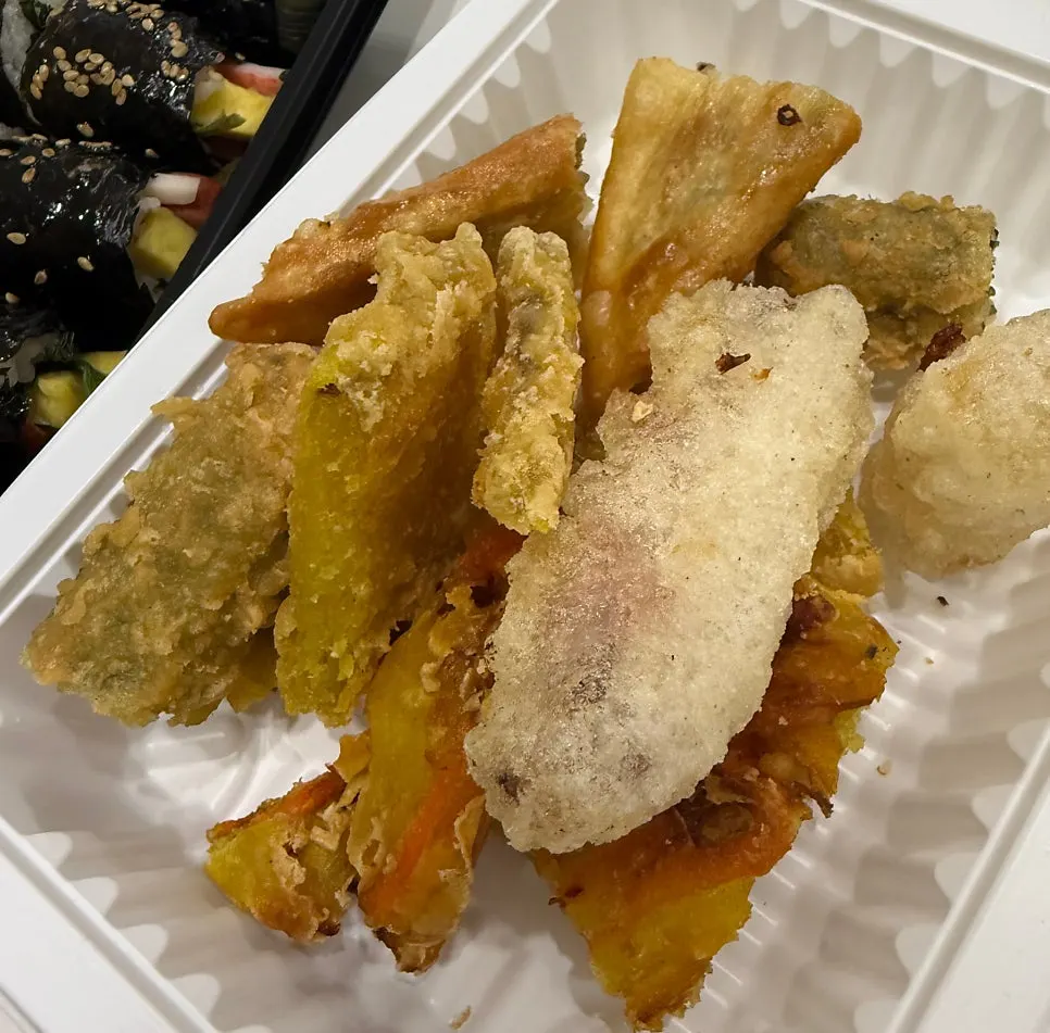 Crispy fried snacks packed together with the tteokbokki