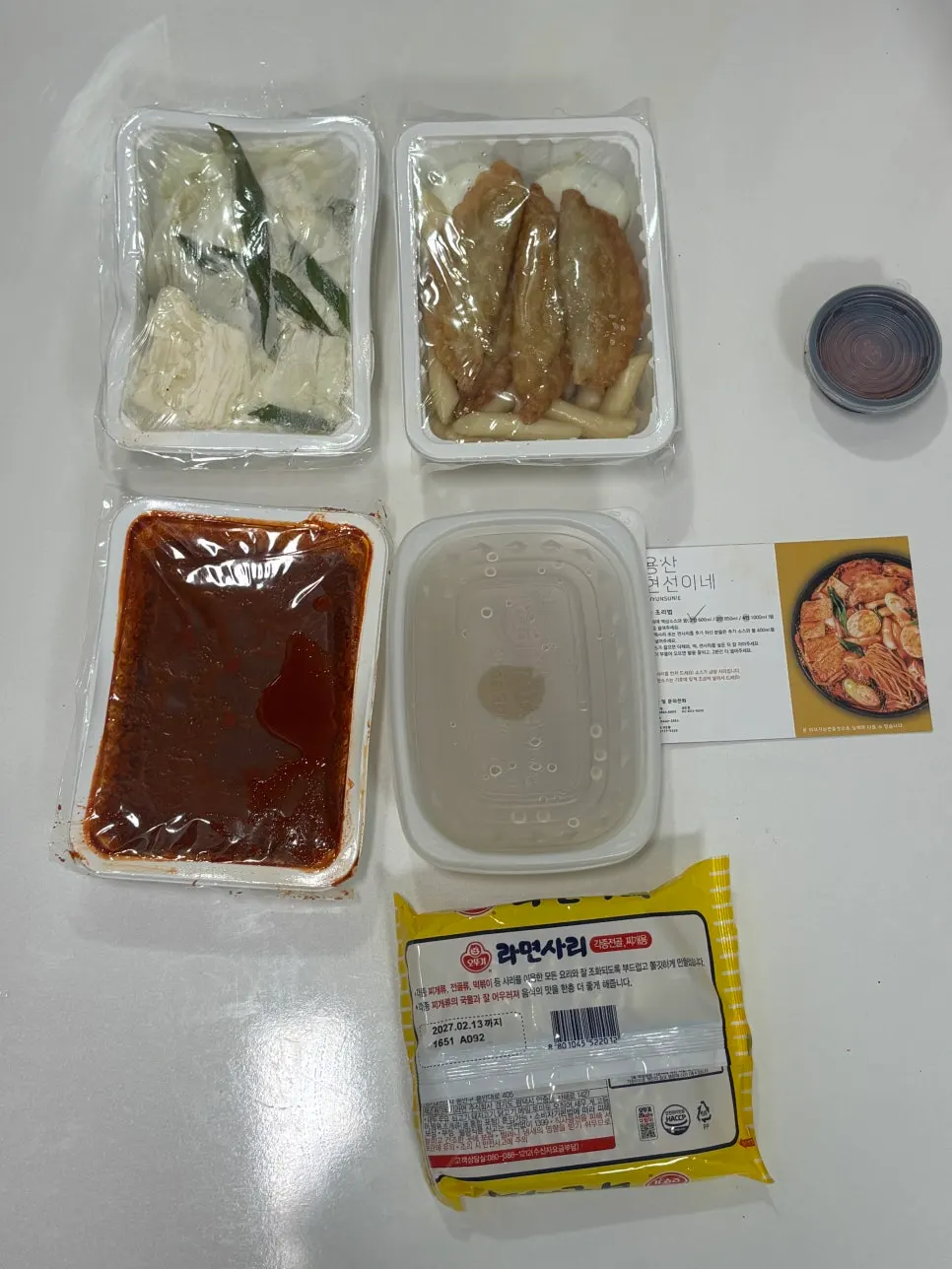 Takeaway shopping bag of Hyeonseonine instant tteokbokki being carried home