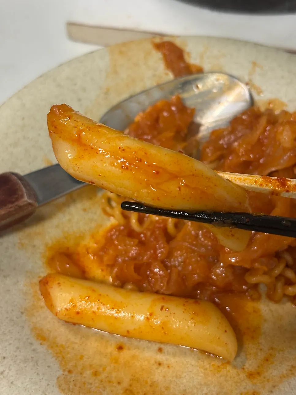 Close-up of the pot with sauce deeply soaked into the rice cakes