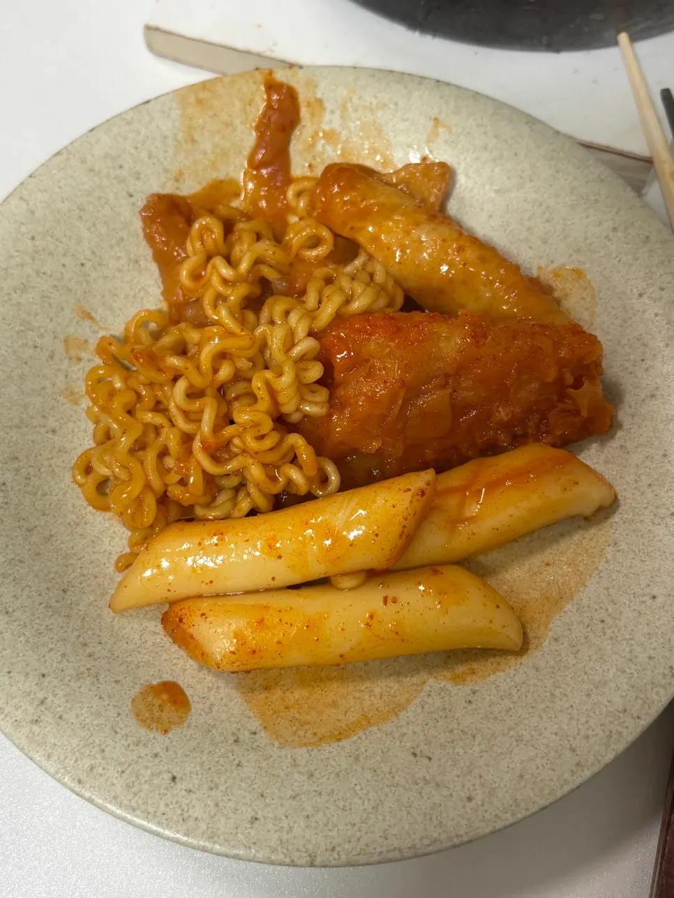 A piece of rice cake plumped up and soaked with broth