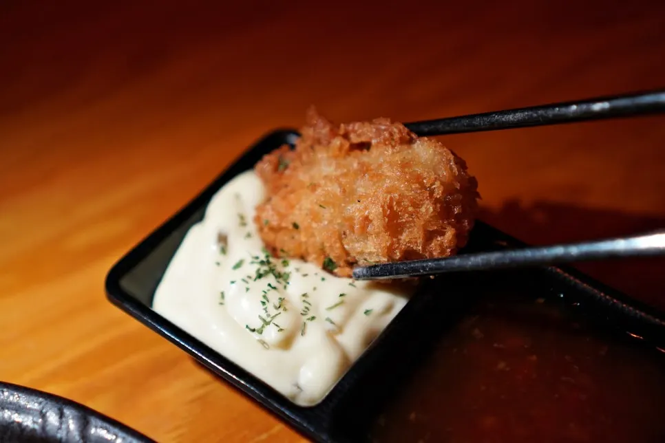 Oyster fritter showing its plump interior