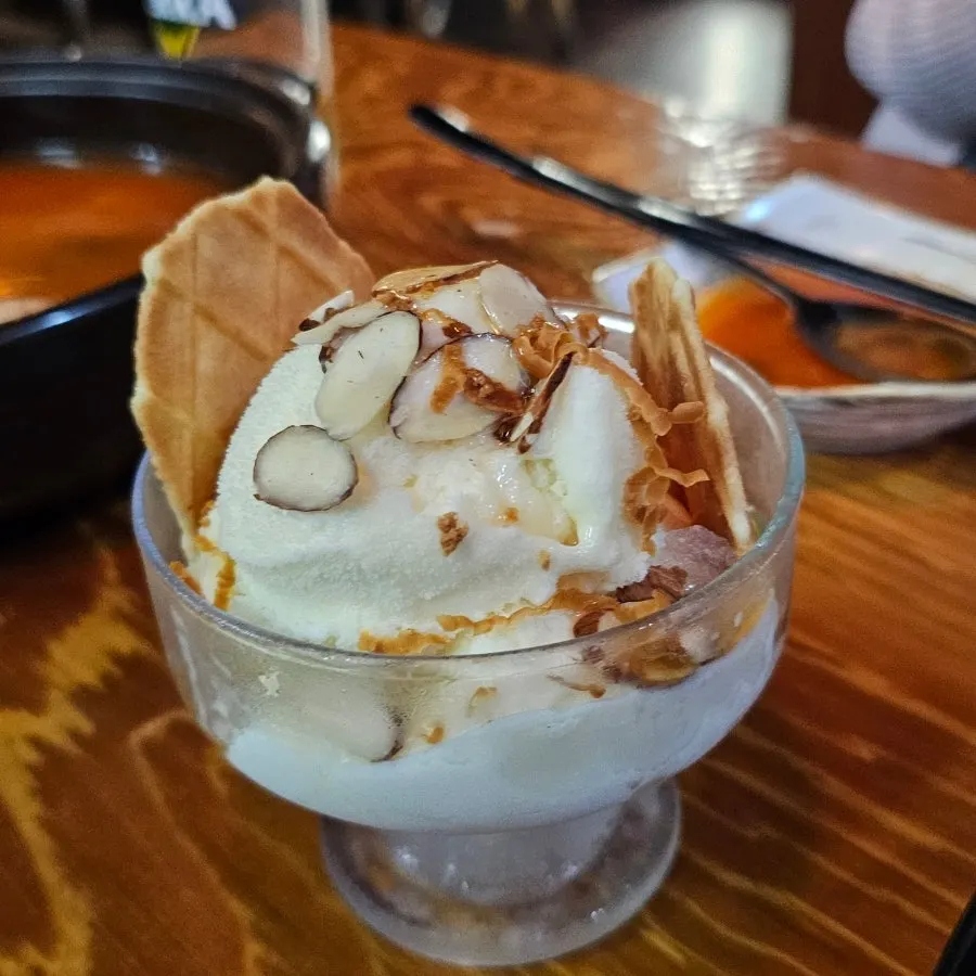 Dessert served with a waffle cookie